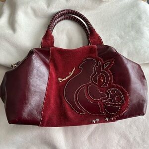 Burgundy genuine leather Braccialini handbag.
